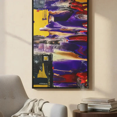 FREEBRD Art Series, Tribal Wave large-scale abstract canvas painting styled in a cozy reading nook with books and coffee, bold purple, red, gold, and yellow acrylic pour art.