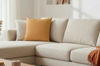 Beige sectional sofa with a Apple Cider Luxury Faux Suede Pillow 