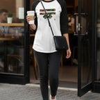 Woman walking outside a cafe holding a coffee cup