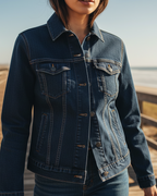Person wearing a blue Freebrd embroidered denim jacket on a beach boardwalk