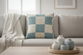 Danish Blue & Cream Woven Check Pillow on a beige couch 