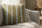 Danish Blue Dark Neutral Wood Striped Woven Pillow on a sofa in a living room setting with decor elements.
