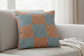 Danish Blue Vintage Salmon Checker Woven Pillow on a light-colored sofa with a neutral background