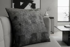 Faded Geometric Net Patterned Woven Pillow on a sofa in a living room setting