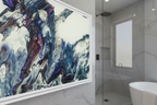 Freebrd "Afrostar" Abstract art piece on a wall in a modern bathroom