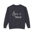 Black sweatshirt with 'Love is Peace' in white text  
