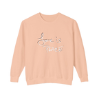 Peachy colored sweatshirt with 'Love is Peace' in white, chocolate shadowed text