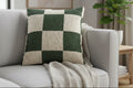 Mughal Green & Cream Checkered Woven Pillow on a gray sofa with a plant in the background