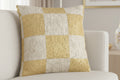 Neutral Yellow Checkerboard Woven Pillow on a beige couch 