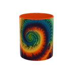 Colorful spiral-patterned mug with orange ceramic handle and insides

