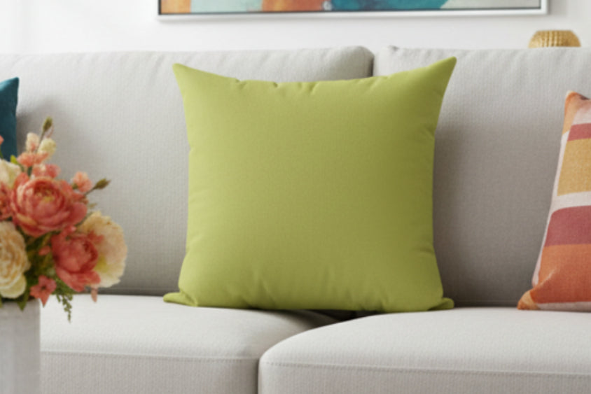 Orchid Green Faux Suede Pillow on  a beige couch