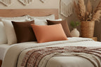 Cozy bedroom with a bed featuring Roman Earth Lumbar Accent Pillow.