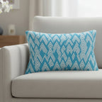 Vintage blue Ikat Lumbar Accent Pillow on a gray sofa