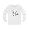 White long-sleeve shirt with 'Thinking Positive Thoughts' in black letter text on a Bella Canvas Unisex Jersey Long Sleeve Tee