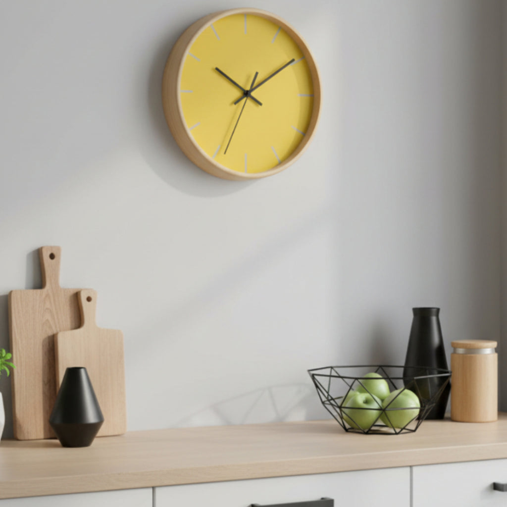 Wooden Base Black Hand Modern Minimal Champ Yellow Silent wall clock on a white wall with kitchen decor items below.