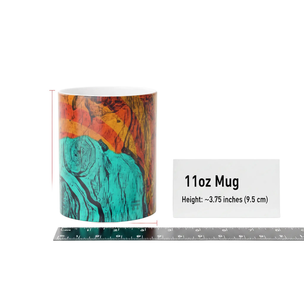 Size reference shot of Freebrd Abstract Bare Lady 11oz ceramic art mug with abstract fluid art in teal, burnt orange, and black — standard mug size, heat-reactive, glossy finish, hand wash only.