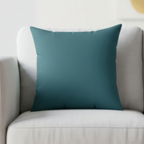 Abstract teal faux suede pillow styled on sofa, moody aqua accent home decor.
