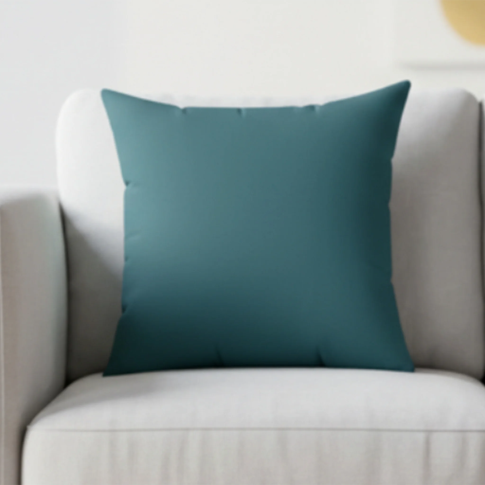 Abstract teal faux suede pillow styled on sofa, moody aqua accent home decor.