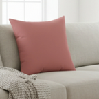 Adore pink faux suede throw pillow styled in living room, lifestyle view.