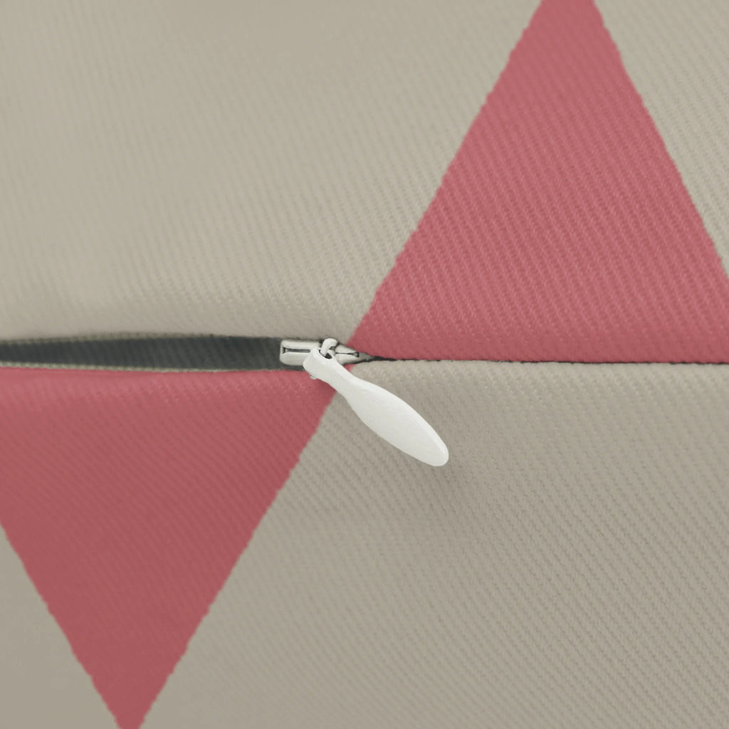 Adore pink triangle pattern lumbar pillow, zipper view.