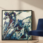 "Afrostar" 36x36 square framed abstract canvas by FREEBRD leaning against a modern interior wall beside a contemporary accent chair — size reference for large square framed wall art decor.