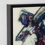 Close-up texture detail of "Afrostar" framed abstract canvas by FREEBRD — fluid pour art in navy, indigo, purple and ivory on premium DTF canvas with black wood frame and archival matte finish.
