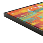 30x30 "Ali Sgrattage" Freebrd Abstract Framed Canvas — side depth shot showcasing 1.25" thick gallery-depth canvas edge and slim black frame profile with true-to-color fiery orange, yellow and teal artwork visible.