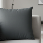 Anchor Grey faux suede pillowcase styled on a couch in a modern living room.