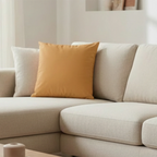 Apple Cider faux suede pillow case styled on a couch in a modern living room.