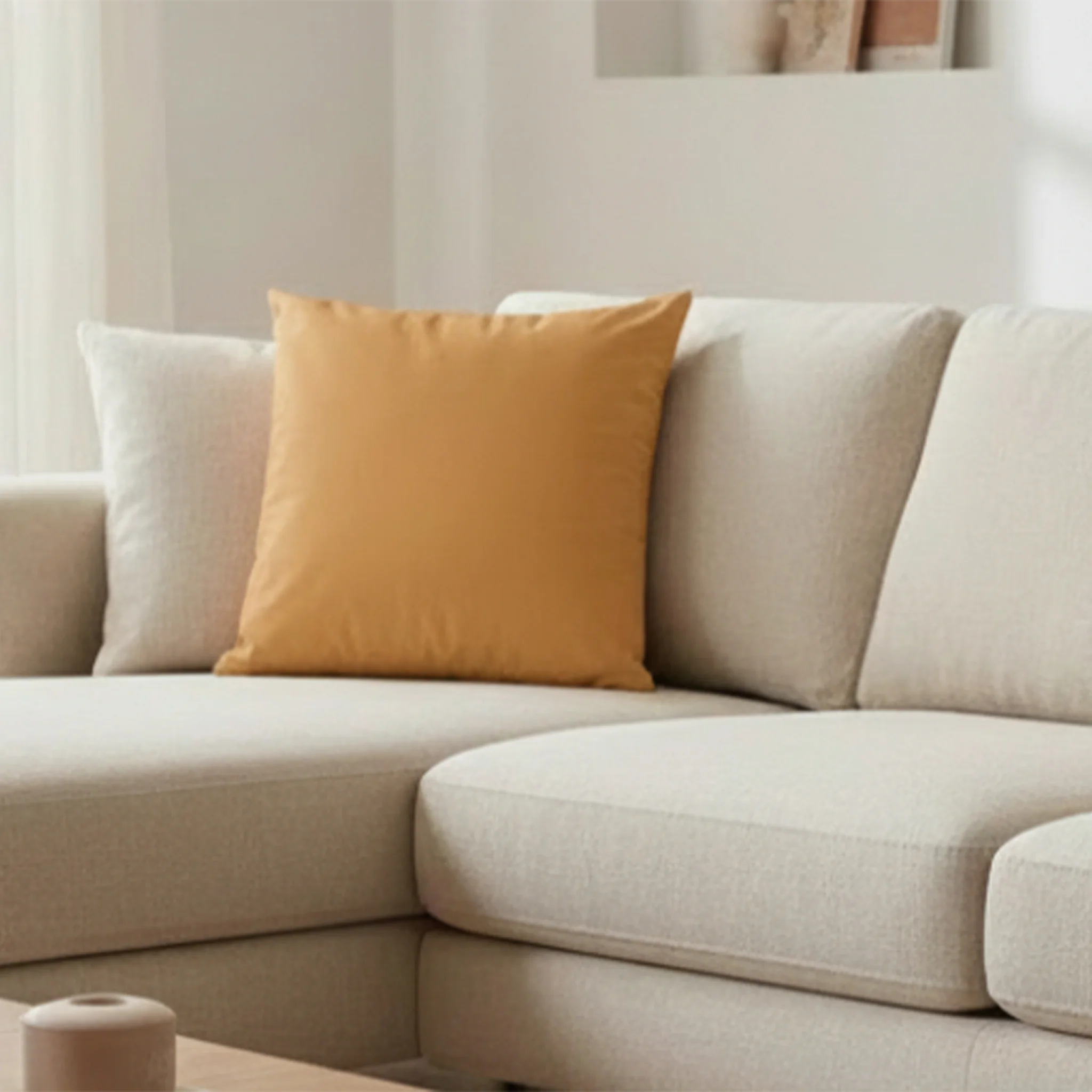 Apple Cider faux suede pillow case styled on a couch in a modern living room.