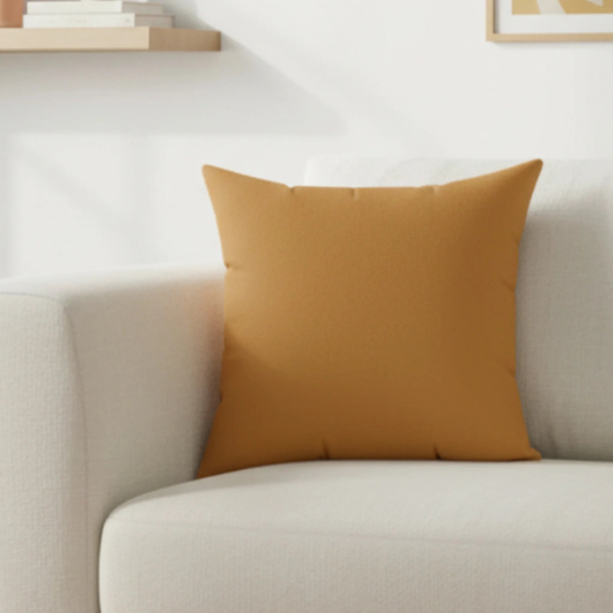 Apple cider faux suede pillow styled on sofa, warm amber autumn home decor.
