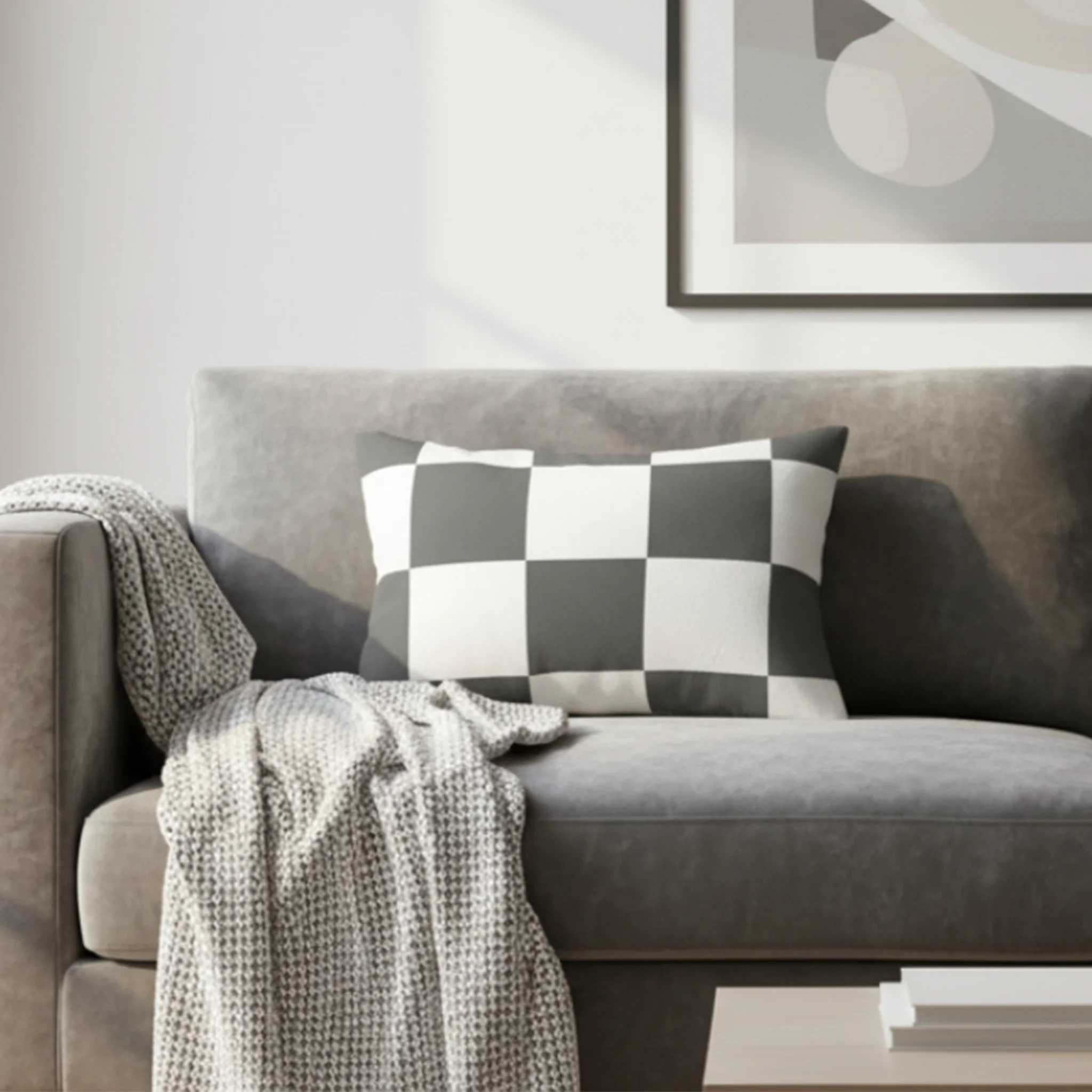 Atomic grey checkered lumbar pillow styled on a couch in a modern living room. 