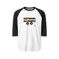 A white raglan tee with black sleeves featuring the hashtag Freebrd logo and two horizontal bars filled with an autumn botanical print of red roses, deep green leaves, and peach gold florals, with a small gold accent dot.