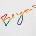 Be You rainbow script essential t-shirt, white, rainbow script graphic detail close-up, FREEBRD Pride Gear.