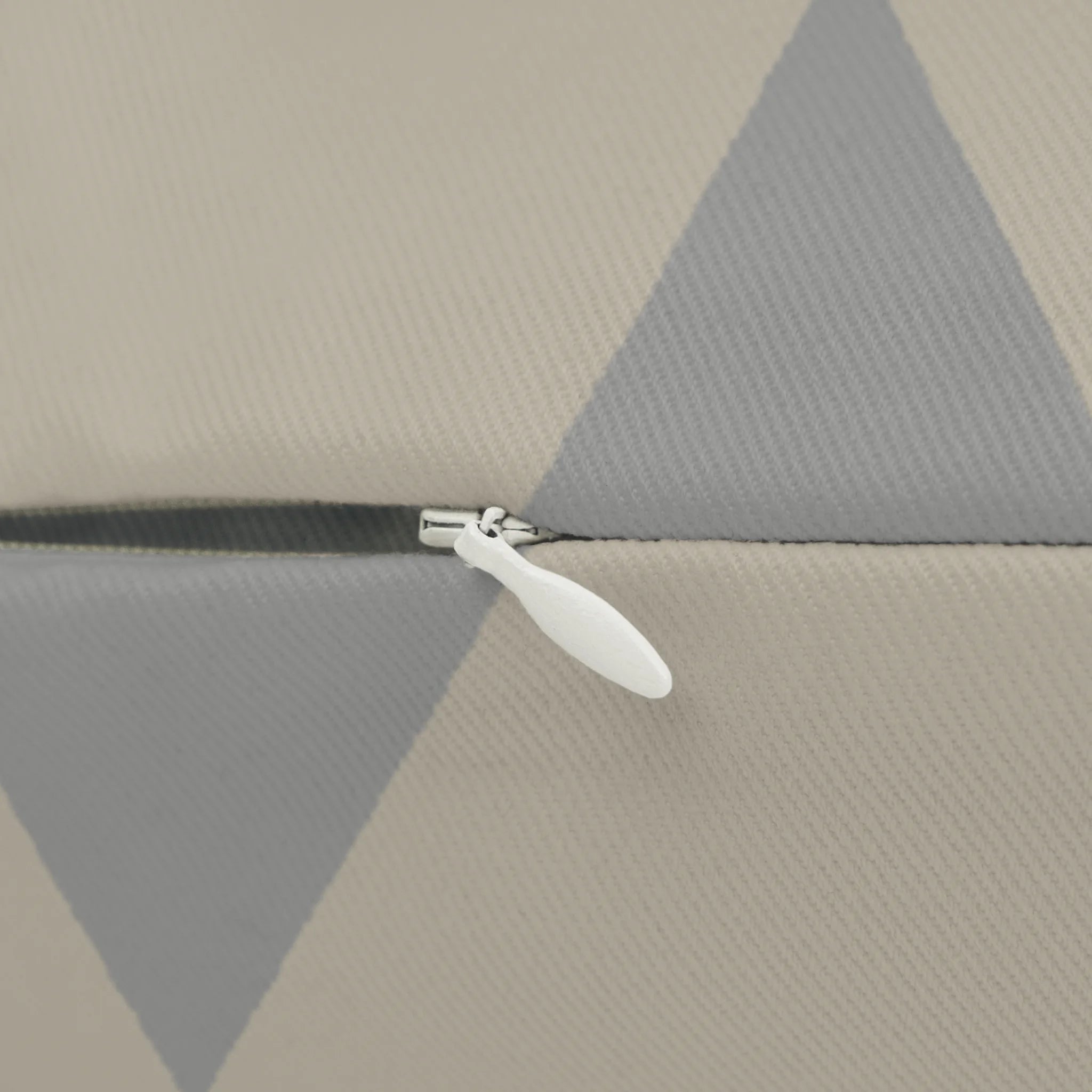 Beige stardust grey geometric triangle lumbar pillow, zipper view.