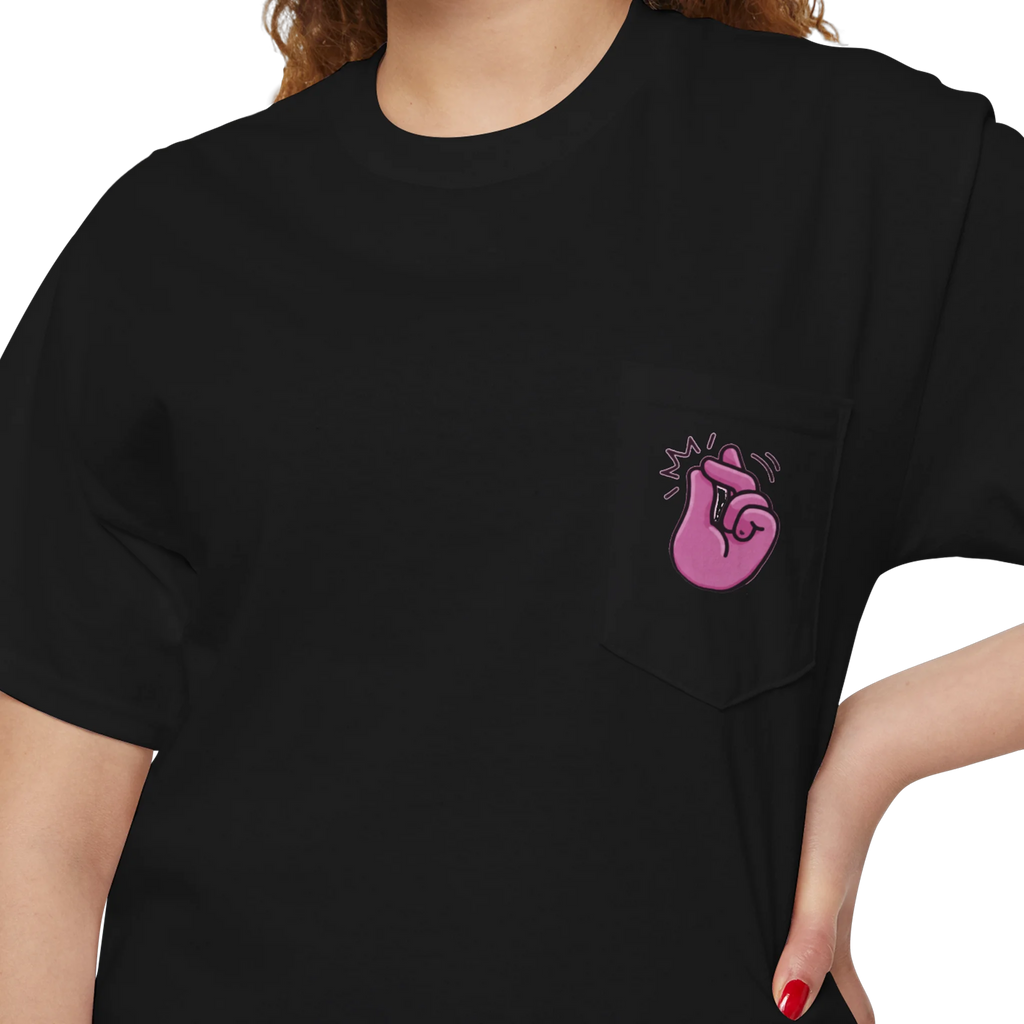 A person wearing a FREEBRD black classic cotton pocket t-shirt with a baby pink cartoon finger-snap Clock It graphic printed on the front chest pocket.