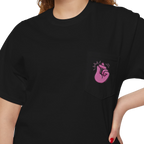 A person wearing a FREEBRD black classic cotton pocket t-shirt with a baby pink cartoon finger-snap Clock It graphic printed on the front chest pocket.
