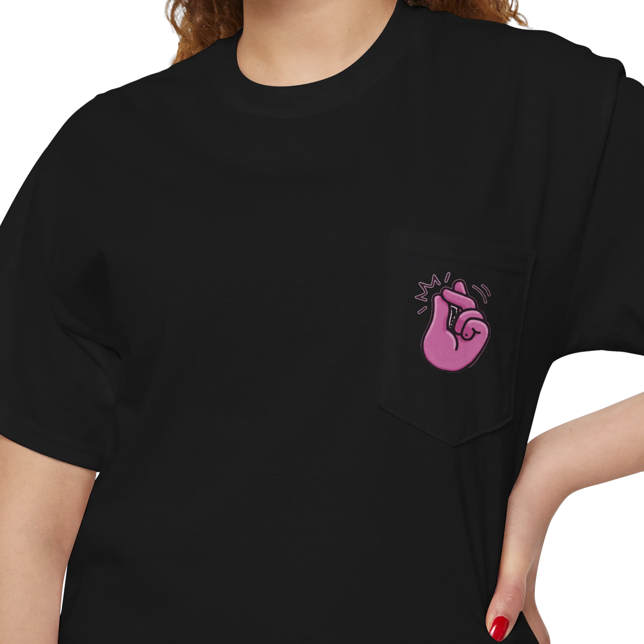 A person wearing a FREEBRD black classic cotton pocket t-shirt with a baby pink cartoon finger-snap 'Clock It' graphic printed on the front chest pocket.