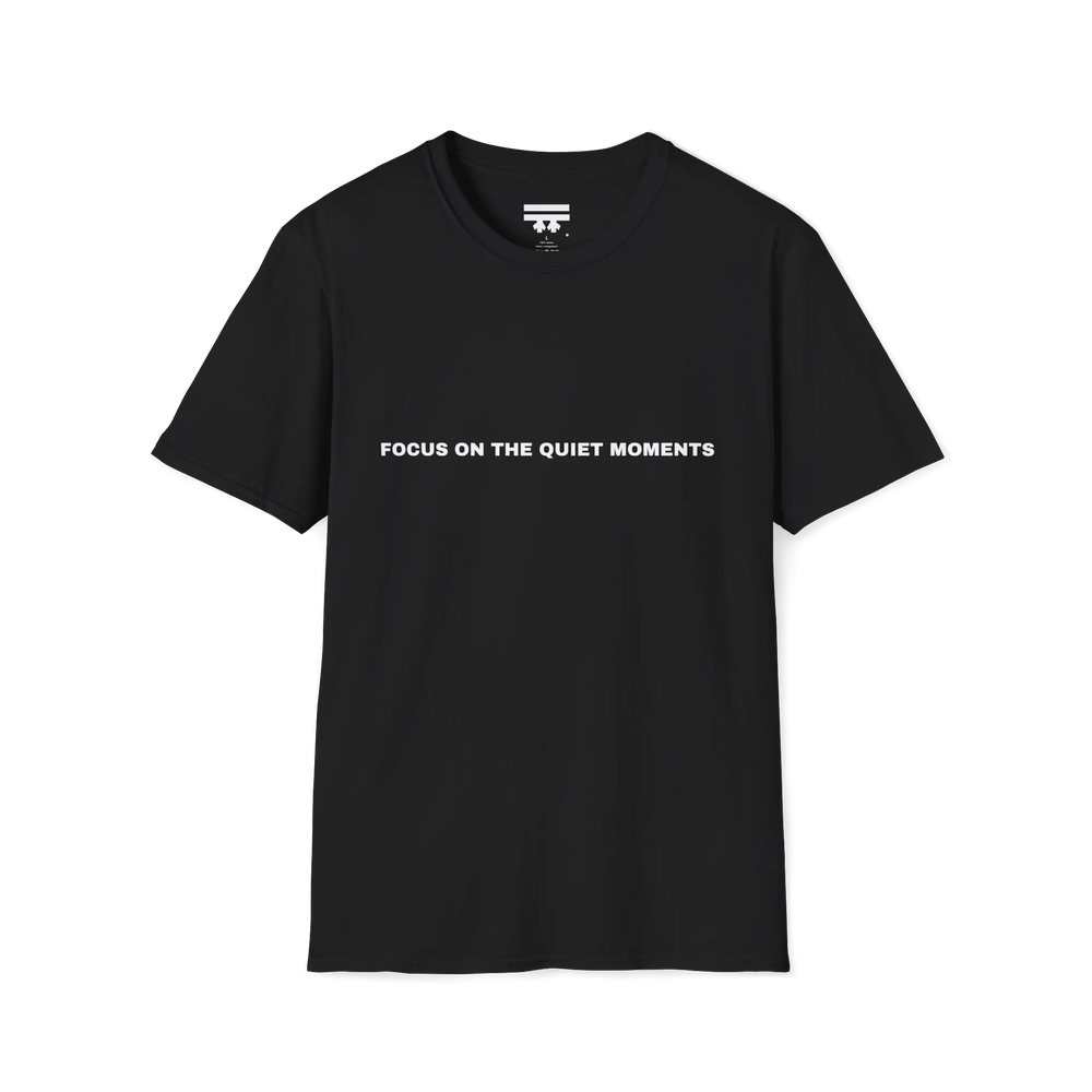 A black t-shirt with white Focus On The Quiet Moments text on the chest.