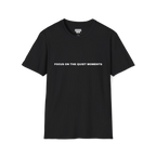 A black t-shirt with white Focus On The Quiet Moments text on the chest.