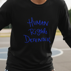 Black Human Rights Defender long sleeve tee, royal blue graphic, outdoor lifestyle front view.
