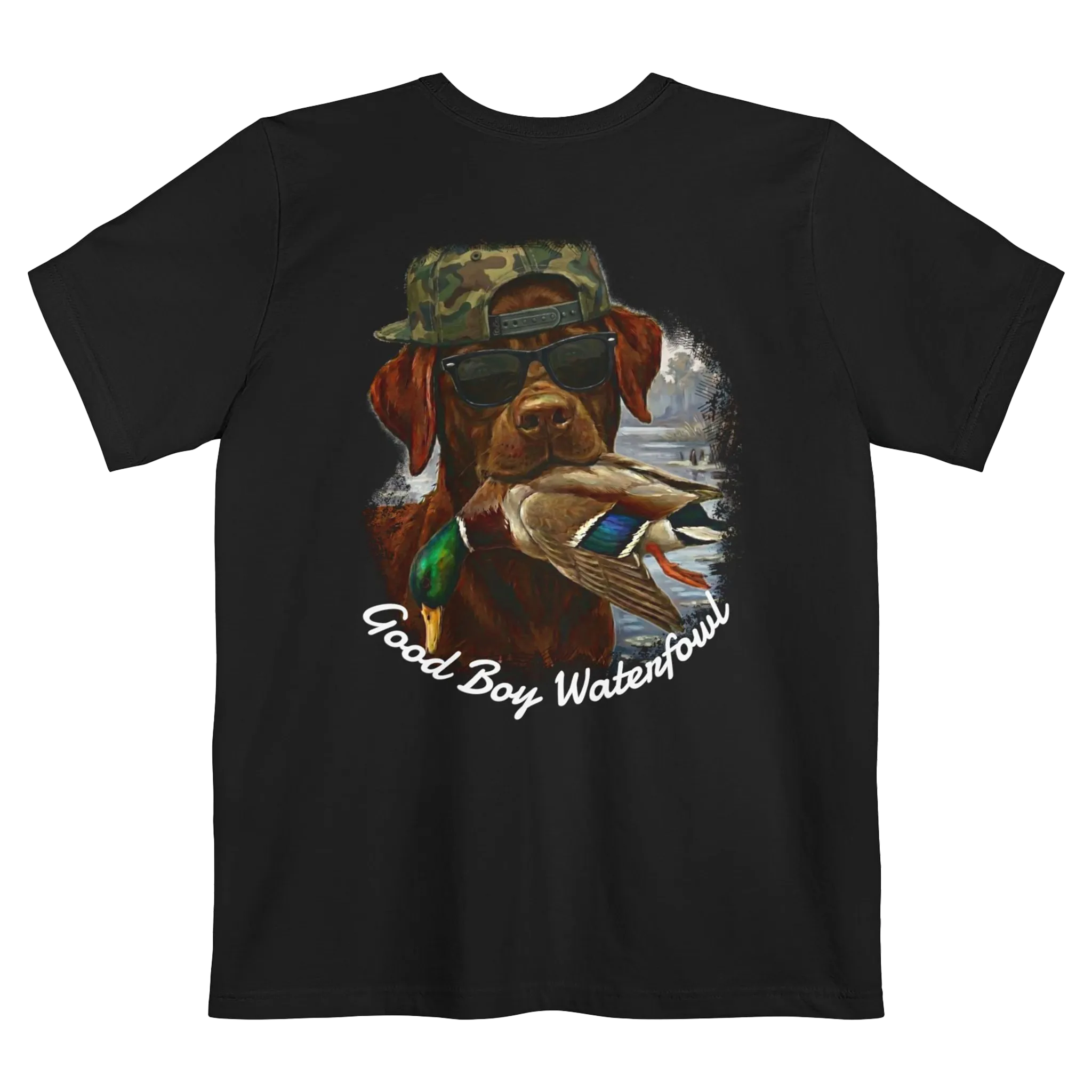 A black t-shirt featuring the Good Boy Waterfowl graphic of a chocolate Labrador wearing sunglasses and a camo snapback, holding a mallard duck, with a watercolor outdoor scene and 'Good Boy Waterfowl' script below.