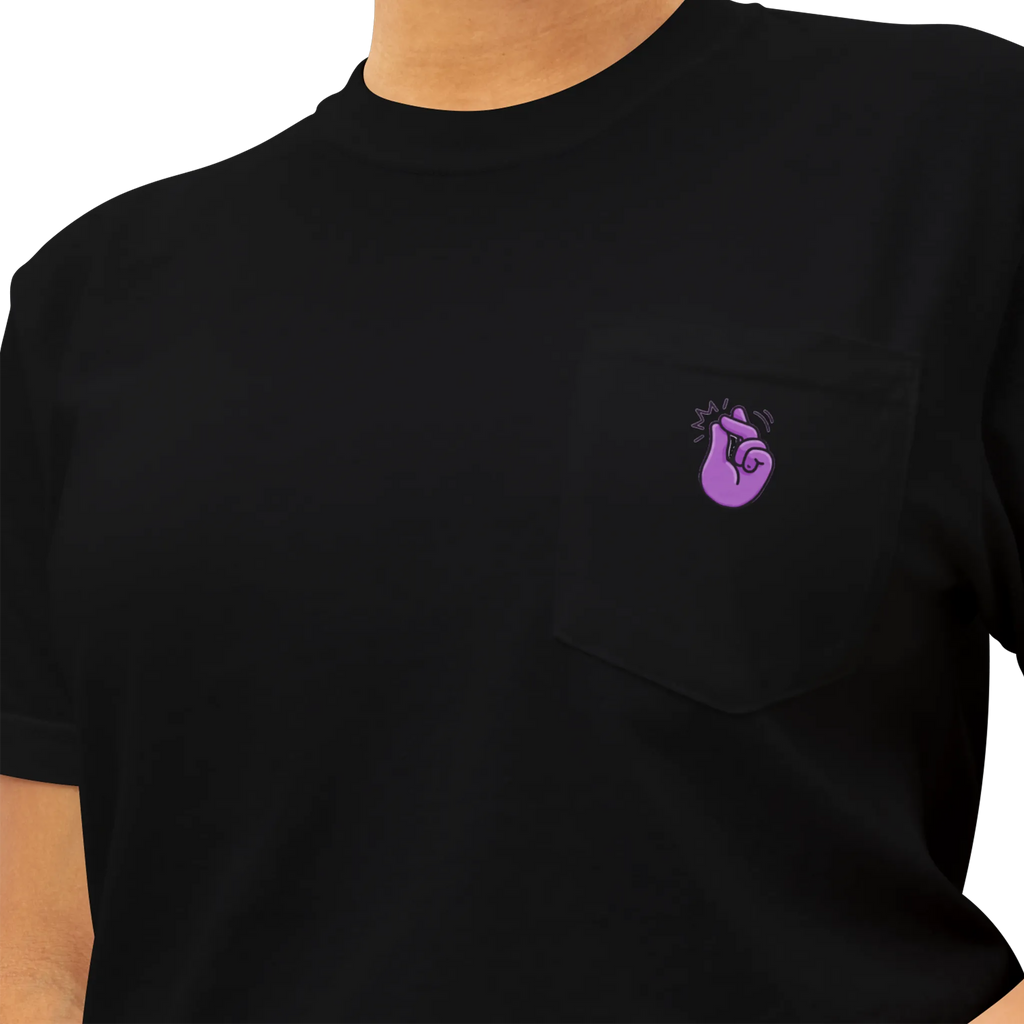 A black pocket t-shirt with a purple Clock It Motif on front left chest pocket shown close up.