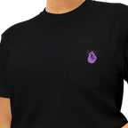 A black pocket t-shirt with a purple Clock It Motif on front left chest pocket shown close up.