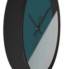 Abstract teal silent wall clock, black base, black hands, black markers, 10 inch, side view.