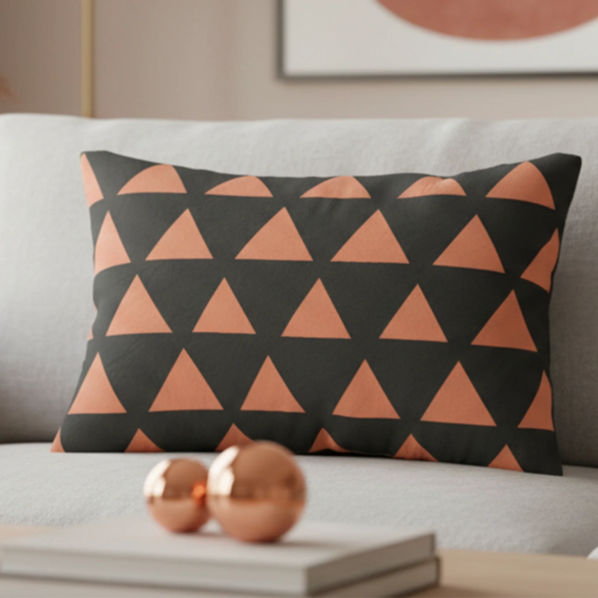 Carbon fiber boho rust geometric triangle lumbar pillow styled on a couch in a modern living room. 