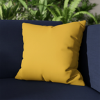 Champ Yellow faux suede pillowcase styled on a couch in modern living room.