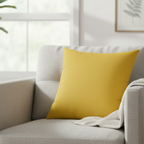 Champ yellow faux suede pillow styled in a sofa chair, warm golden yellow home decor.