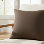 Country brown faux suede pillow styled on sofa, warm dark brown rustic home decor.