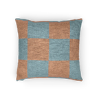 A horizontal view of the Danish Blue Vintage Salmon Checker Woven Pillow showing danish blue checker squares on a salmon red background.